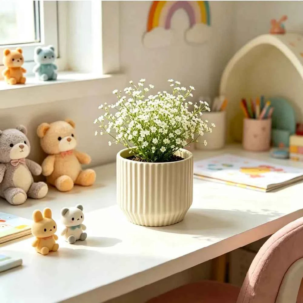 White ribbed ceramic planter with small white flowers