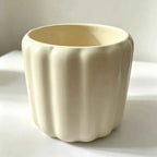 Cream scalloped ceramic planter cup with wide open rim