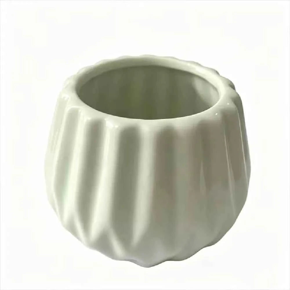 Light mint ceramic planter with scalloped vertical ridges, open bowl shape