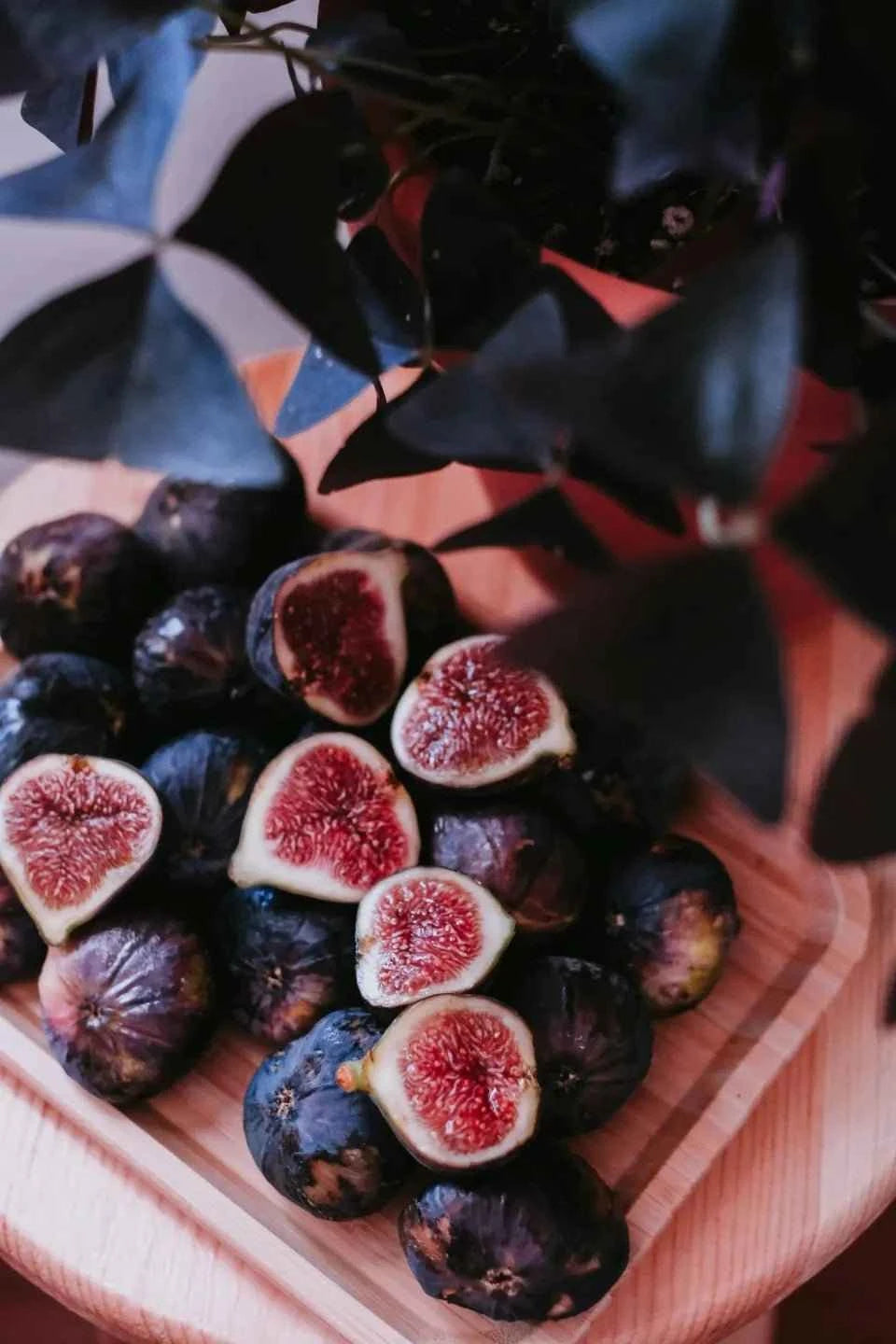 Fresh dark figs with red, seedy centers in a bowl