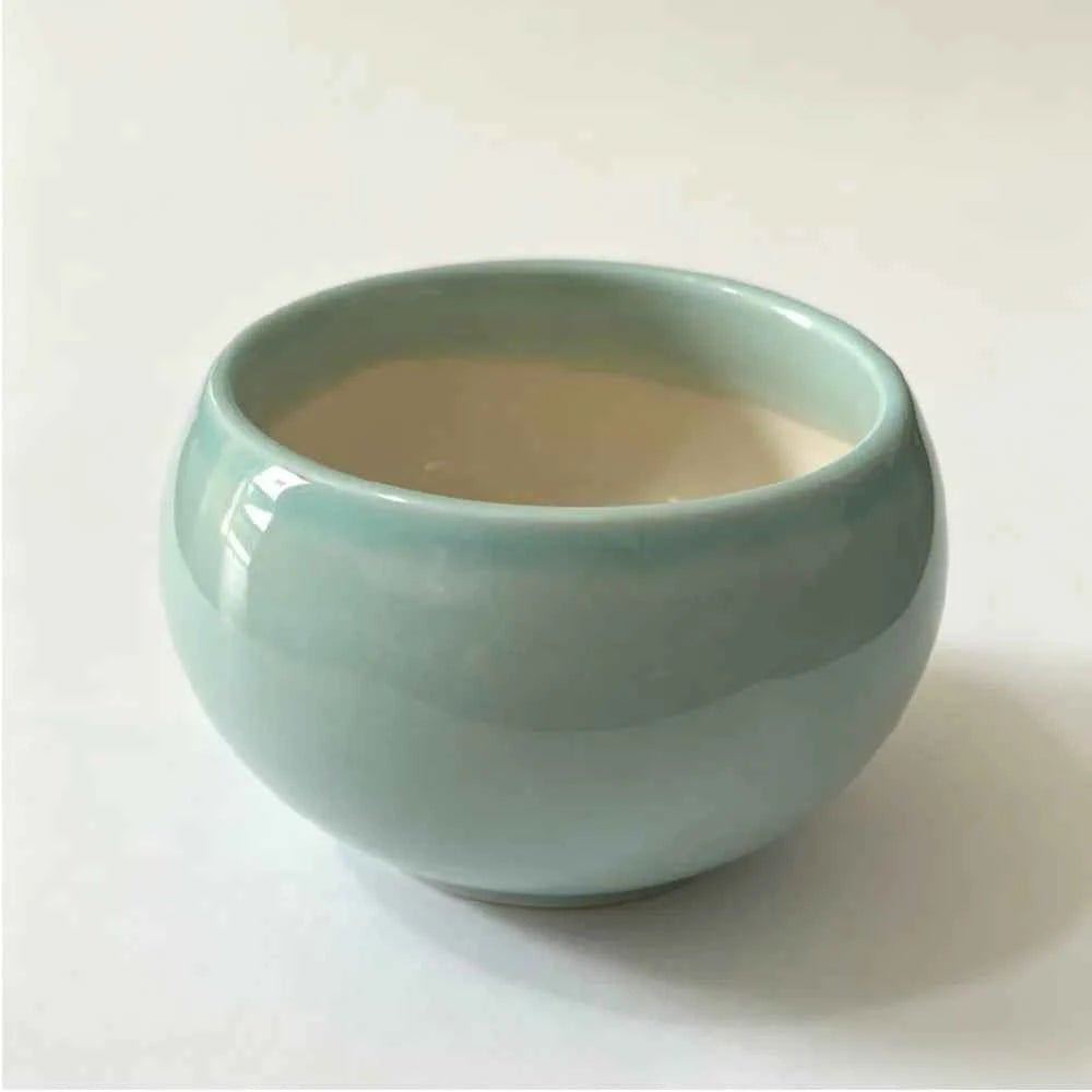 Teal bowl-shaped ceramic planter, 3.5 in, front view.