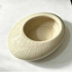 White shallow ceramic planter bowl with crackle glaze and wide opening, side view