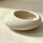 White shallow ceramic planter bowl with crackle glaze, empty interior
